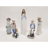 Lladro porcelain figure of a sailor boy, seated on a column holding a model ship and four Nao