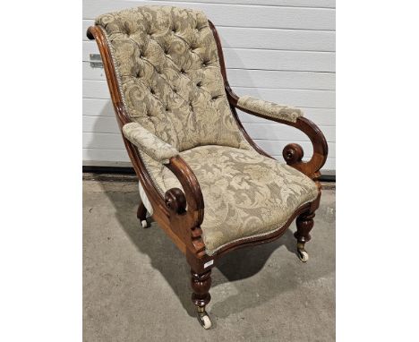19th century mahogany armchair with button back and scrolling arms, on turned front legs, with ceramic castors, 91cm high&nbs