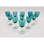 Set of green and turquoise tinted drinking glasses, early 20th century, in various sizes