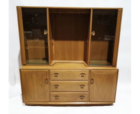 Ercol ''Windsor'' elm dresser,&nbsp;the top with central open, illuminated section with two adjustable glass shelves, flanked