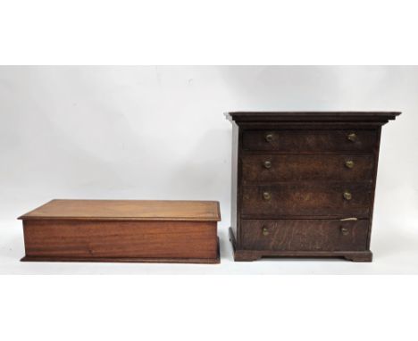 19th century oak table-top cabinet, the moulded top above four long graduating drawers, with brass handles on bracket feet an