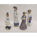 Four Nao figures of children, printed brown marks, various impressed letters and numerals,