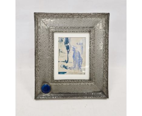 Arts & Crafts pewter rectangular picture frame, inset with a Ruskin-style blue glazed circular plaque, the frame with hatched