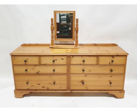 Modern pine low dresser&nbsp;by Ducal, comprising four short and four long drawers, each with metal handles, raised on bracke