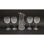Four cut glass red wine glasses by Fred Curtis, each cut with a band of ovolos above hobnail
