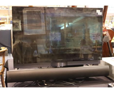 Bang and Olufsen Beovision 7-32 with sound bar and Beo4 remote, built-in DVD with table stand. Not available for in-house P&P