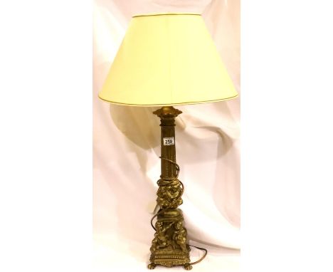 Large brass table lamp with decorative putti, H: 60 cm. Not available for in-house P&P, contact Paul O'Hea at Mailboxes on 01