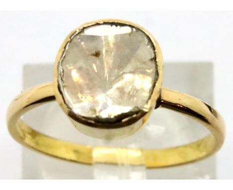 Yellow metal and 1.5ct rough cut diamond solitaire in closed back ring, size O. P&amp;P Group 1 (£14+VAT for the first lot an