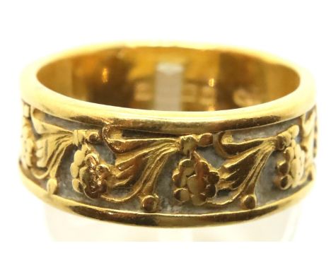 22ct gold band ring, floral designed in relief, Birmingham 1963, size P, 8.4g. Some minor surface marks due to general wear, 