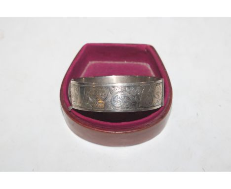 A silver snap bangle, approx. total weight  57gms