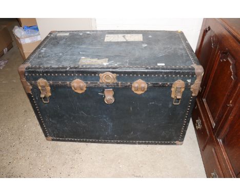 A large metal bound travelling trunk