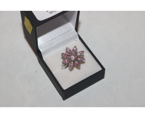 A large Sterling silver and pink topaz flower head dress ring, size N/O