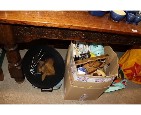 A box of various sundry items and a portable typewriter in fitted carry case