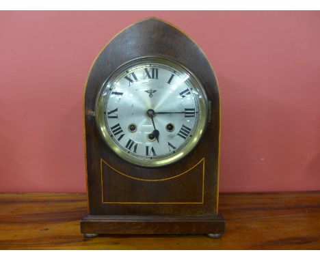 An early 20th Century German inlaid mahogany mantel clock