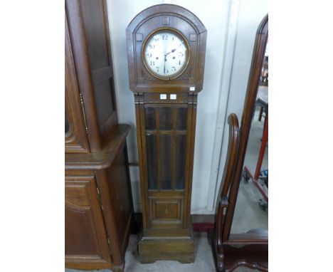 An oak longcase clock