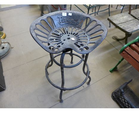 A steel swivel tractor seat stool