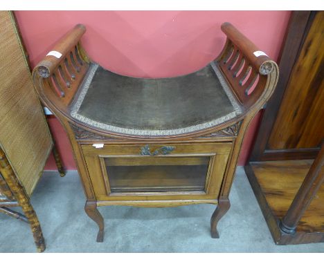 A Victorian walnut piano stool