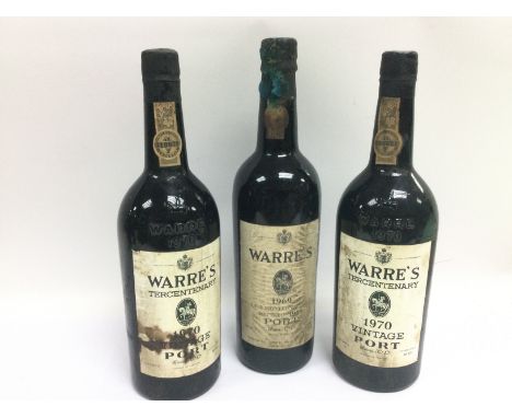 Three bottles of Warre's vintage port comprising a 75cl 1969 bottle and two from 1970 (3). Shipping category D.