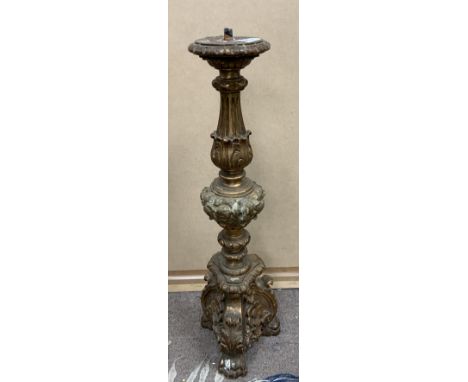 A carved and gilt wooden candlestick, 60cm. (D).