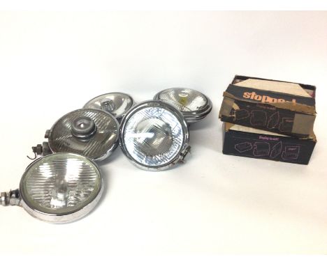 Six vintage chrome cased spotlights and two boxed new old stock stop lamps for vintage car. Postage category D