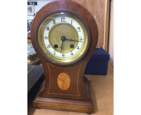 A Edwardian inland mantle clock the circular dial with Roman numerals.