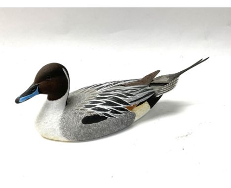 A small finely carved lime wood carving of a Northern pintail drake, 1/3rd scale, carved by David Patrick Brown c.1993. 16cm.