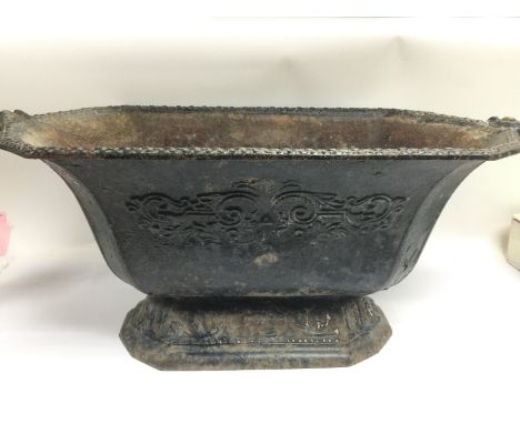 A cast iron Victorian planter, approx width 58.5cm. Possible foundry mark to one of the handles. Shipping category D.