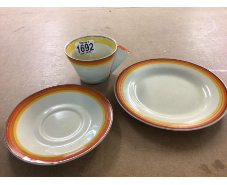 A Clarice Cliff Trio including cup, saucer and side plate