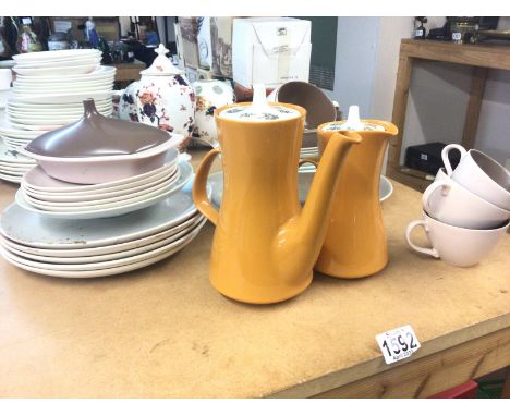 A collection of Poole ceramics including tea and dinnerware. Postage category D.