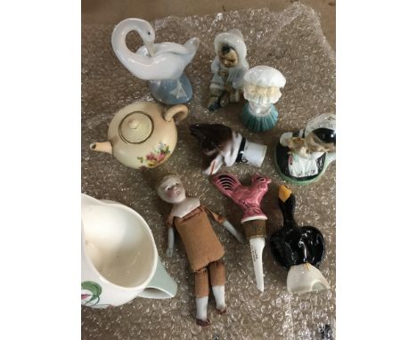 A collection of ceramics including a bisque headed doll, Suzie Cooper, Lladro, Royal Worcester teapot and candle snuffer