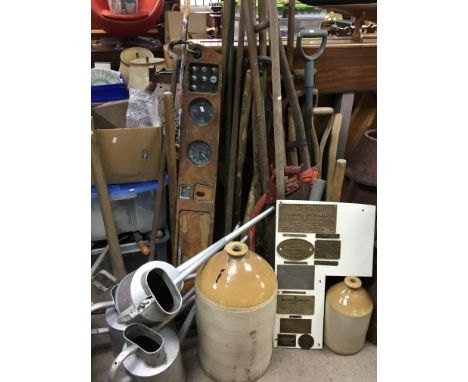 A collection of vintage gardening tools a Vintage walnut car dashboard galvanised watering cans and a plaque with industrial 