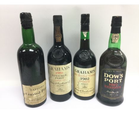 Four bottles of vintage port comprising a 1970 bottle of Grahams port, 1967 Dow's, Taylors 1964 and Grahams 1982 (4). Shippin