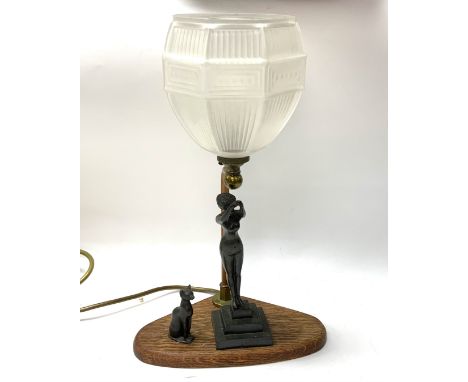 A 1930s lady lamp with an oak base and glass shade. 34cm.