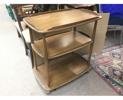 An Ercol three tier tea trolley, approx 71cm x 46cm x 77cm.