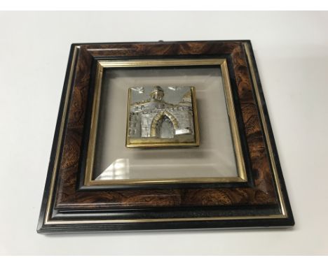 A mantle clock and small picture
