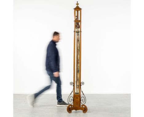 An Exceptionally Long Candle in a Special Cabinet, marked 'Roma 1867'. 19th C.An exceptionally long candle, decorated with fl