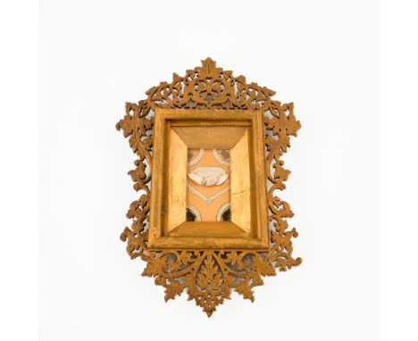 A wood sculptured reliquary shrine with relics for Saint Basilidus and Chanel.- Ex Vestibus Beati Chanel- Ex Vestibus Beati C
