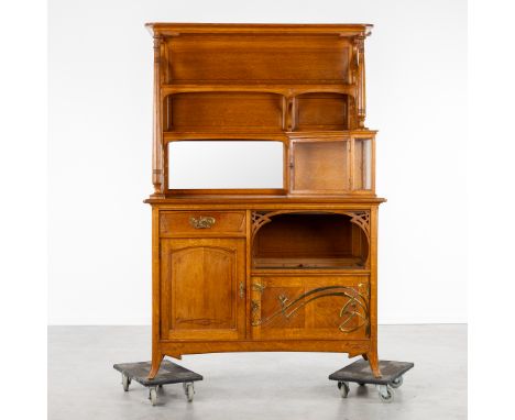 A 'Deux Corps' Cabinet, Art NouveauMounted with brass fittings. Finished with mirror and display cabinet.(141 x 210 x 60 cm)E