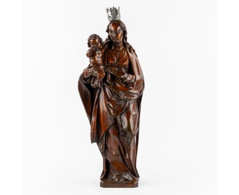 An Antique Oak Sculpted Statue, Madonna and Child, with Silver Crown, Flanders, 18th century.Sculpted oak.Silver crown, uncle