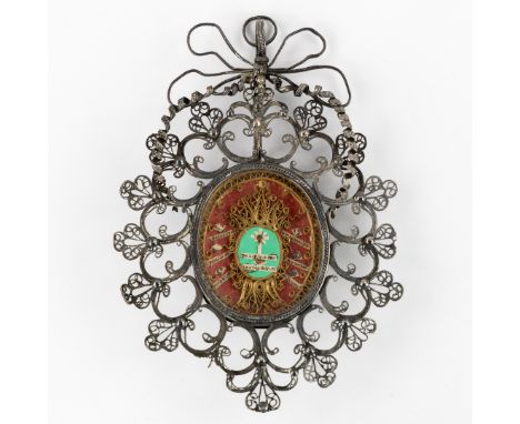 A silver reliquary, with multi theca with relics for True Cross, Saints and Martyrs.Silver reliquary, filigree work.Not marke