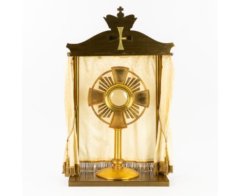 A modernist monstance with matching Shrine, brass. 20th C.A brass monstrance in a modernist style.Marked on the base Bastiaen