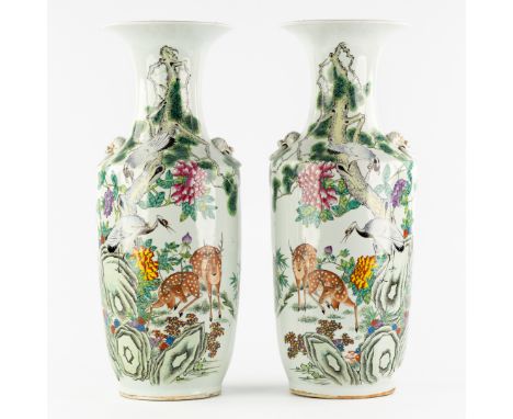 A Pair of Chinese Famille Rose Vases, decorated with Deer and Cranes in a Garden.Chinese porcelain, famille rose.Decorated wi