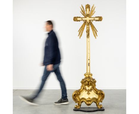 A Large Wood-sculptured Church Crucifix with Corpus Christi. Gilded and Patinated Wood. Baroque Revival, 19th century.Sculptu