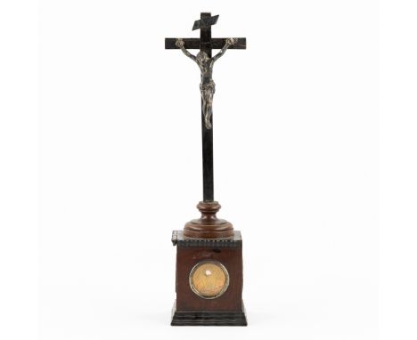 A wooden Relic Cross with Corpus Christi, with three theca.Ebonized crucifix mounted with a bronze corpus christi and INRI ba