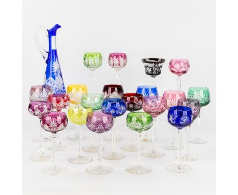 Val Saint Lambert and Bohemia, A collection of 22 coloured goblets and a carafe. Cut Crystal.Cut and coloured crystal.Most of