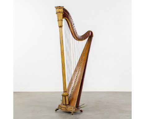 French School, A Neoclassical Partially Gilt and with Rosewood finished harp. Circa 1900.The harp on the bottom with various 