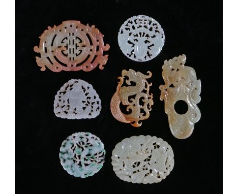 Collection of Chinese Jade and hardstone, to include an example with a bird and flower surround, 55mm diameter, an oval examp