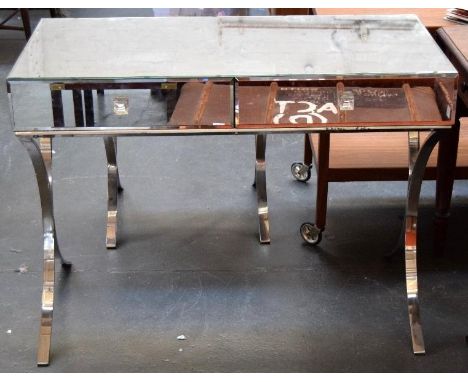 A Barcelona console table, with mirrored top, sides, back and front, two drawers with glass handles, on two chromium plated X