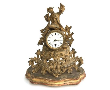 A Louis XVI style gilt metal mantel clock, Roman numerals to dial, topped by a figure of a huntsman holding his game, raised 