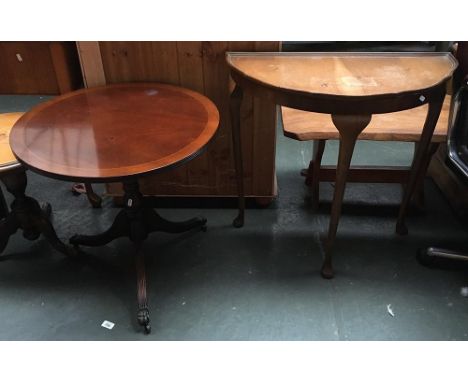 A reproduction Regency style mahogany circular side table on three outswept legs with brass claw cappings, 61cmD; together wi
